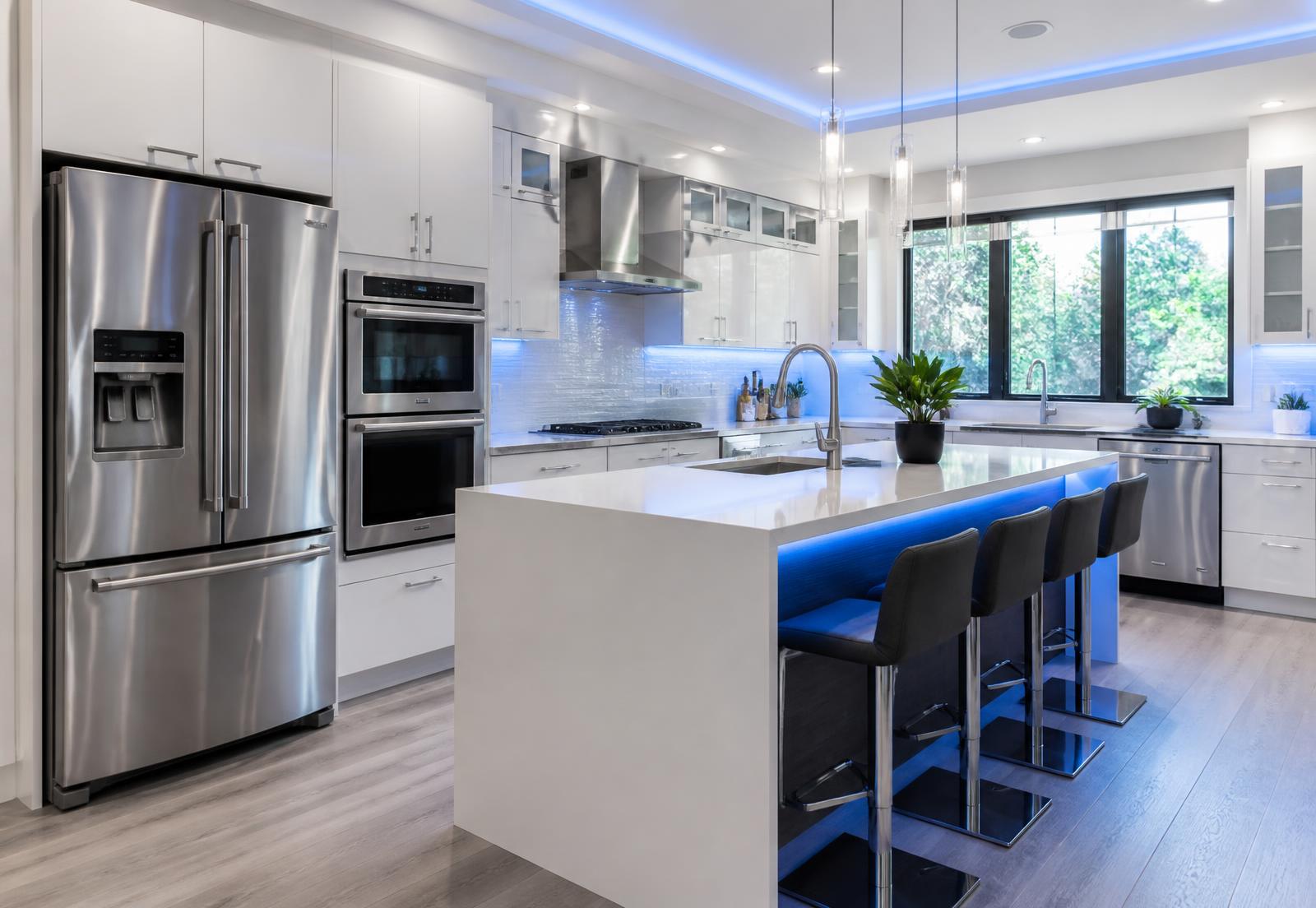 Modern kitchen with refrigerator, wall oven, cooktop and dishwasher